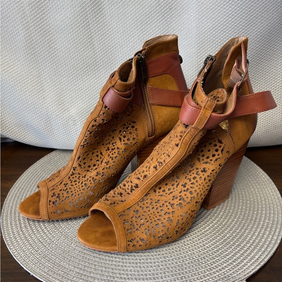 Vince Camuto dark tan perforated bootie with wood stacked heel. - Picture 1 of 4